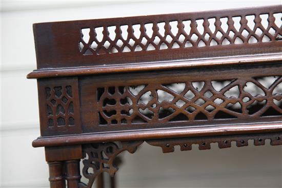 A pair of Georgian style pierced fretwork silver tables 2ft